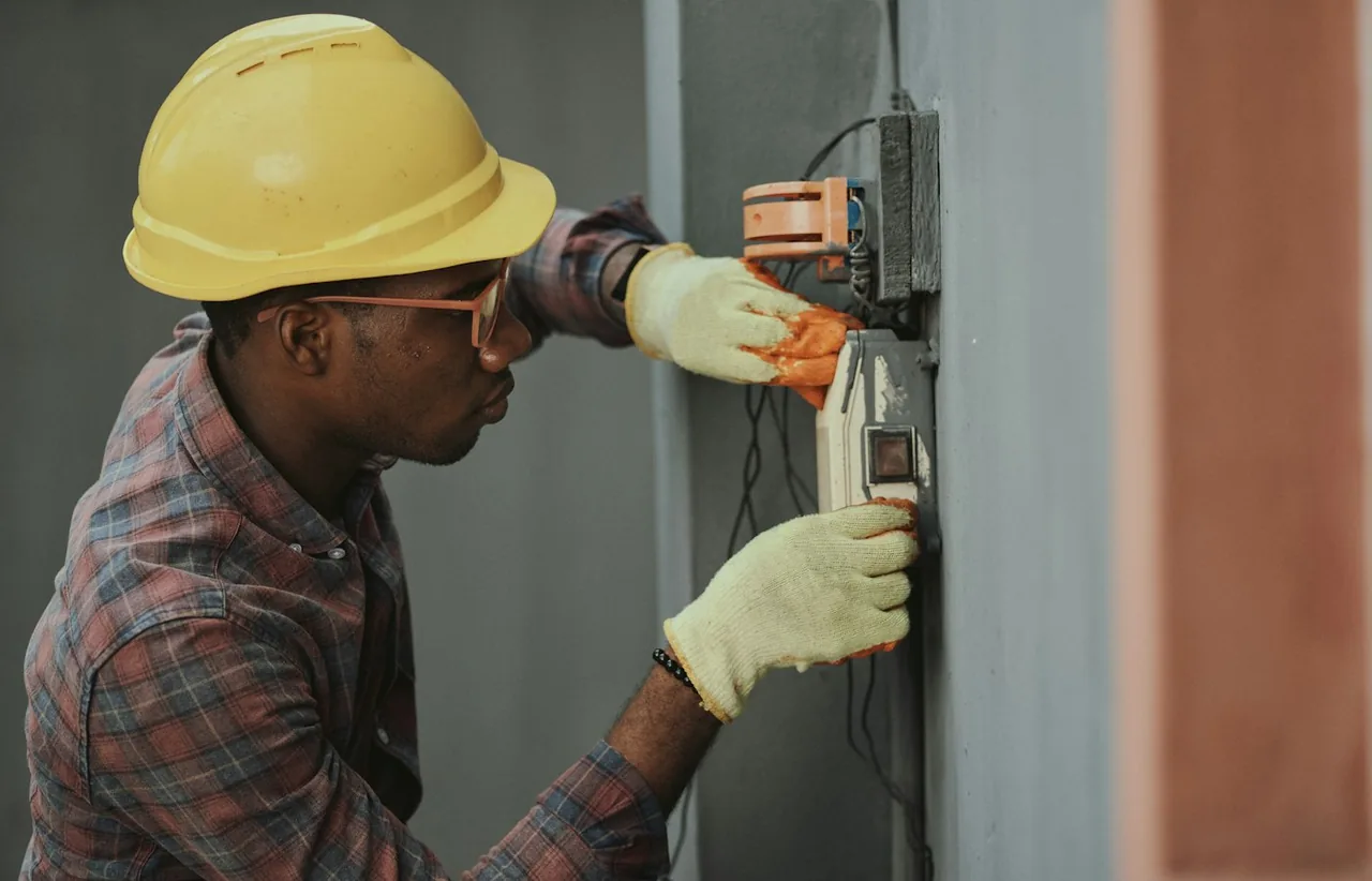 Electrician working at a residential electrical panel